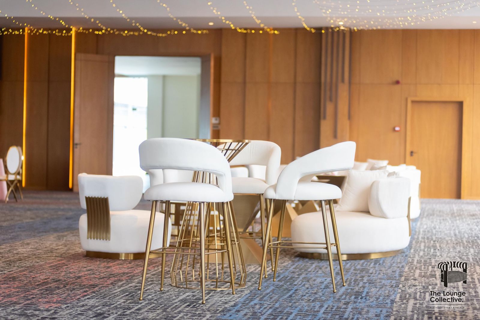 A Brushed Gold lounge corner with armchairs and a cocktail table