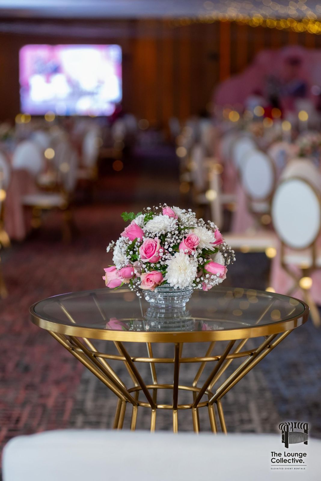 Gold cocktail table with fresh flowers