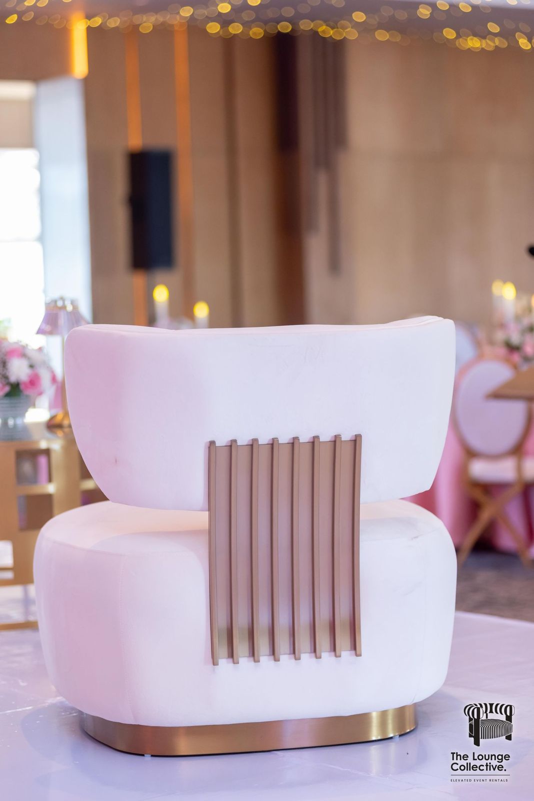 A Brushed Gold armchair with its gold panel back